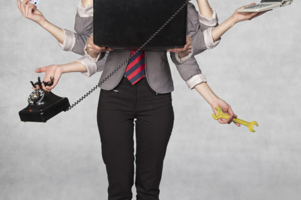 multipurpose business woman on the grey background